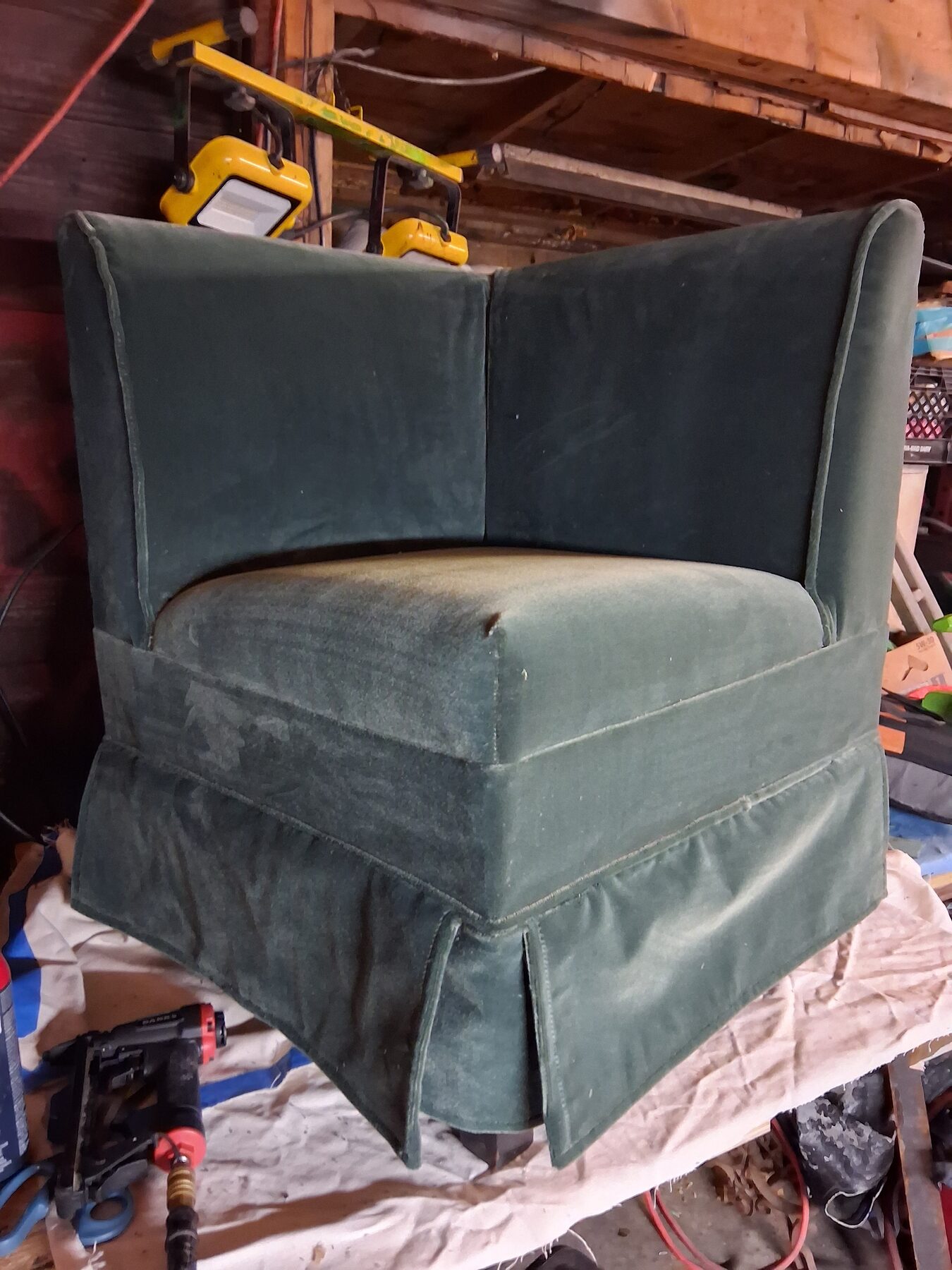 Corner chair in worn green velvet, as it arrived for re-covering